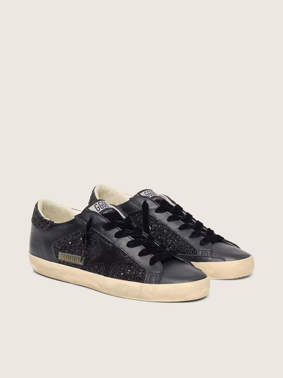 Super-Star pour femme à paillettes noires avec étoile en daim noir et empiècements en cuir