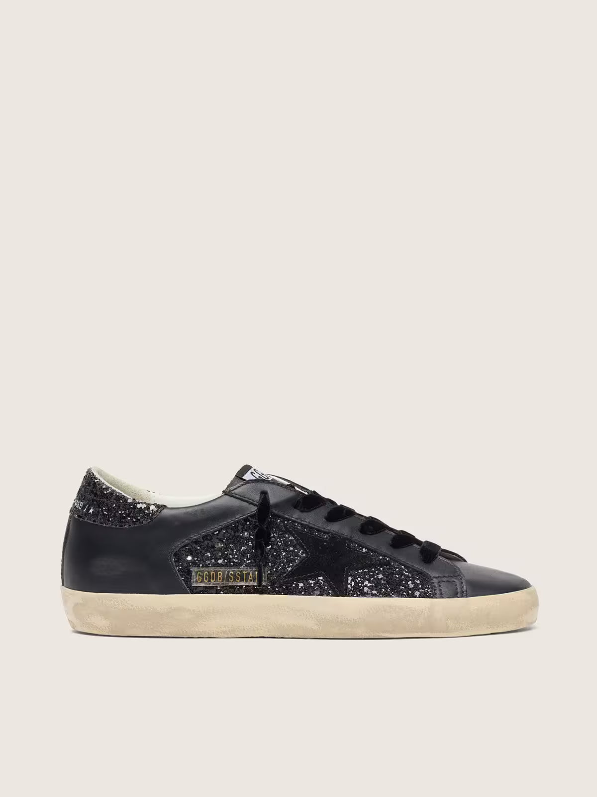 Super-Star pour femme à paillettes noires avec étoile en daim noir et empiècements en cuir